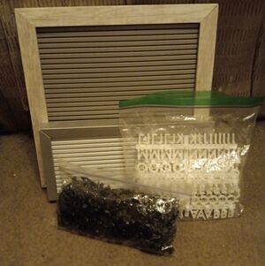 2 letter boards with letters and numbers